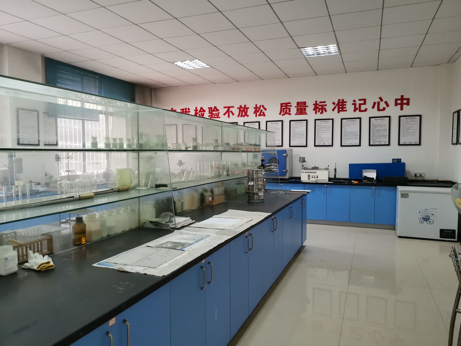 Quality control laboratory with testing instruments and certificates
